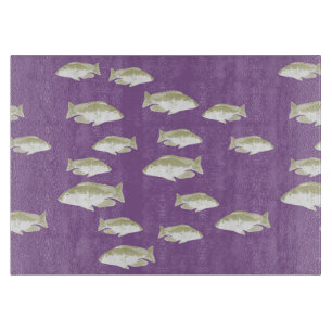 Fish on purple cutting board