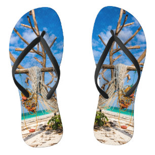 Fishing nets drying on the beach flip flops