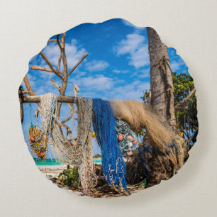 Fishing nets drying on the beach round pillow