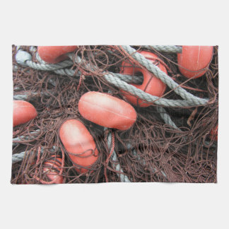 Fishing nets, floats and rope on the harbour kitchen towel