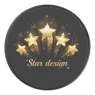 Five gold stars on black hockey puck