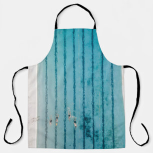 Five people swimming on pool apron