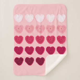 Five rows and columns of knitted hearts sherpa blanket