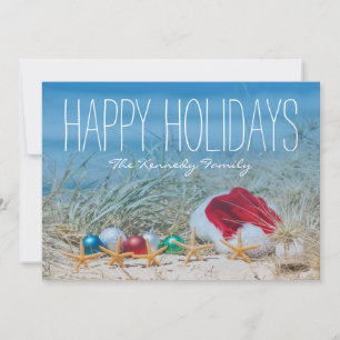 Five starfish on a beach with a Santa hat Holiday Card