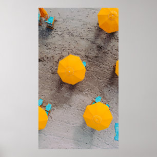 Five yellow umbrellas on sand at daytime poster
