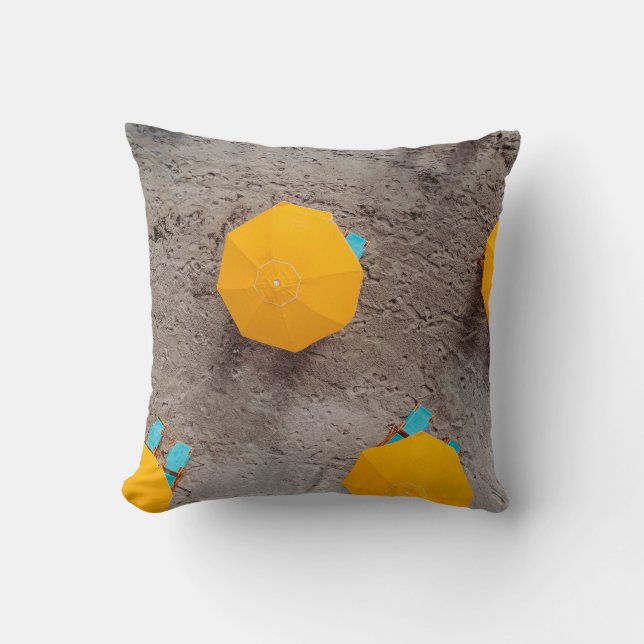 Five yellow umbrellas on sand at daytime throw pillow (Front)