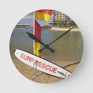 Flags and surf rescue board round clock