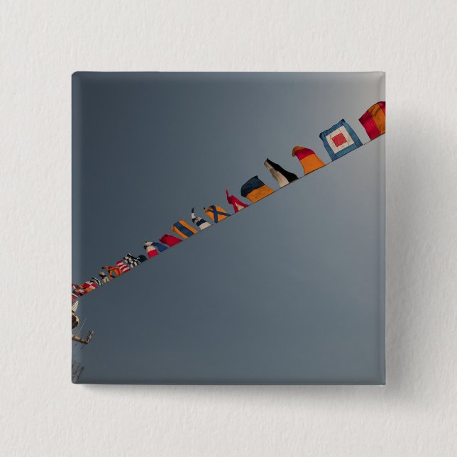 Flags fly over the deck of the USS Iwo Jima 2 Inch Square Button (Front)