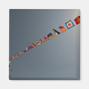 Flags fly over the deck of the USS Iwo Jima Magnet