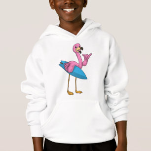 Flamant rose comme Surfer avec Surfboard
