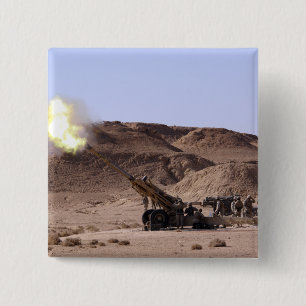 Flame and smoke emerge from the muzzle 2 inch square button