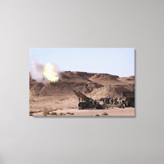 Flame and smoke emerge from the muzzle canvas print (Front)