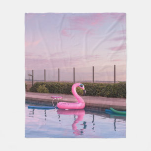 Flamingo water floater in swimming pool fleece blanket