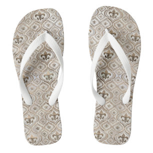 Fleur-de-lis pattern pearl and gold flip flops