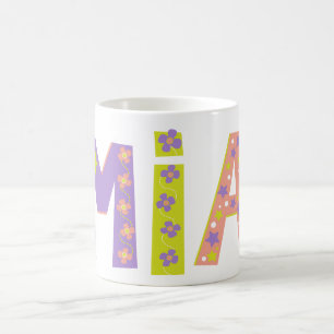 Fleurs Mia décoratives et tasse étoile