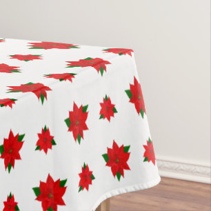 Fleurs Poinsettia de Noël sur nappes blanches