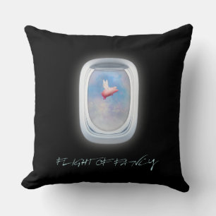 flight of fancy-pig flies past an airplane window throw pillow