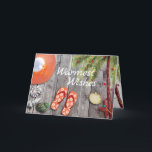 Flip Flops, Palm Tree, Christmas Lights Beach Holiday Card<br><div class="desc">This Warmest Wishes beach holiday greeting card features a cute pair of orange flip flops and sun hat. There are seashells and a watercolor palm tree decorated with Christmas tree string lights, all on a wooden background. Inside Greeting ~ "from my Holiday Paradise to yours... ". The greeting can be...</div>