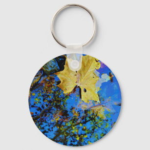floating fall leaf with reflection of blue sky keychain