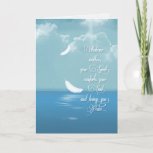 floating feathers over ocean for sympathy card