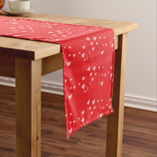 floating hearts on red short table runner
