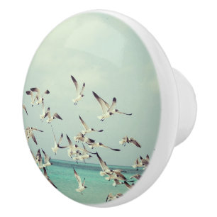 Flock of Flying Seagulls Over Ocean Ceramic Knob