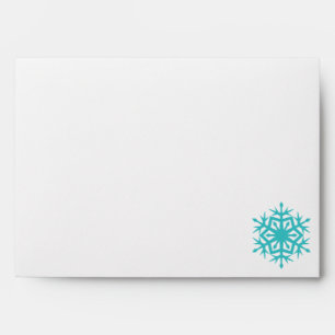 Flocons de neige d'hiver dans des enveloppes turqu