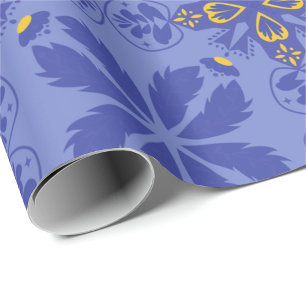 floral and geometric pattern in gold and blue wrapping paper