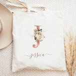 Floral Ivory Rose Gold Monogram Letter J Tote Bag<br><div class="desc">This elegant tote bag features a large letter "J" monogram in faux rose gold foil, decorated with a vintage ivory floral bouquet trimmed with green and rose gold foliage. Personalize it with her name in rose gold handwriting script, with flourishes at the beginning and end. Makes a perfect bridesmaid gift!...</div>