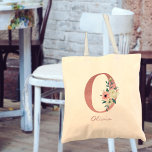 Floral Letter Initial O Watercolor Pink Bouquet Tote Bag<br><div class="desc">Personalized tote bag with your monogram - name and inital. The floral letter O is designed in rose pink glitter and decorated with a pink and ivory bouquet of watercolor flowers and greenery. The template is set up for you to add your name in dusty pink hand lettered script. A...</div>
