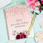 Floral rose gold glitter blush pink 2025 planner<br><div class="desc">A rose gold and blush pink gradient background with elegant rose gold faux glitter drips, paint dripping look. Decorated with flowers in burgundy and rose gold. Template for a year. Personalize and add a name and a title. The name is written in dark rose gold with a modern hand lettered...</div>