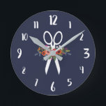 Floral Scissors - Navy Blue Hair Salon Round Clock<br><div class="desc">Round wall clock for a hair salon. Navy blue wall clock featuring a pair of white scissors decorated with flowers. The floral arrangement comprises flowers in red,  orange,  pink,  and white. With white calligraphy numbers.</div>