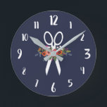 Floral Scissors - Navy Blue Hair Salon Round Clock<br><div class="desc">Round wall clock for a hair salon. Navy blue wall clock featuring a pair of white scissors decorated with flowers. The floral arrangement comprises flowers in red,  orange,  pink,  and white. With white calligraphy numbers.</div>