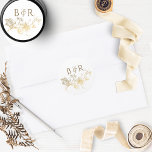 Floral White and Gold Wedding Envelope Seal/Favour Classic Round Sticker<br><div class="desc">Elegant wedding sticker with beautiful faux gold foil hand drawn floral detail and couple's initials. Ideal as envelope seal or favour label.  Part of our " White and Gold Enchanting and Celestial Collection" with a variety of coordinating products including envelopes. Visit the entire collection at:
https://www.zazzle.com/collections/white_and_gold_enchanting_and_celestial_collection-119073673253835730</div>
