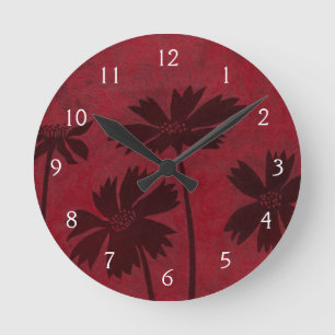 Flowerhead Silhouettes on Crimson Background Round Clock