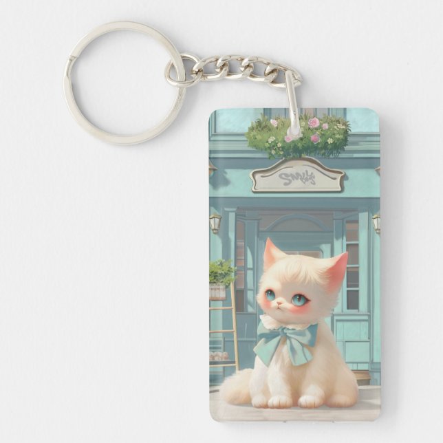 Fluffy Kitten with Blue Bow at Pastry Shop Keychain (Front)