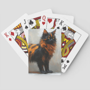 Fluffy maine coon cat playing cards