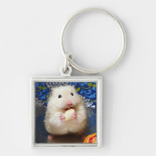Fluffy syrian hamster Kokolinka eating a seed Keychain