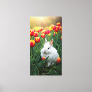 fluffy white rabbit sits among the tulips  canvas print