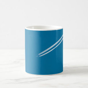 Flying airplane on a blue sky background coffee mug
