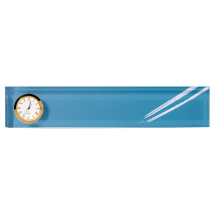 Flying airplane on a blue sky background nameplate
