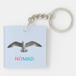 Flying bird and calligraphy on light blue keychain
