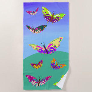 Flying multicolored butterflies beach towel