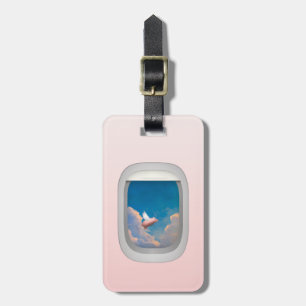 flying pig through airplane window luggage tag