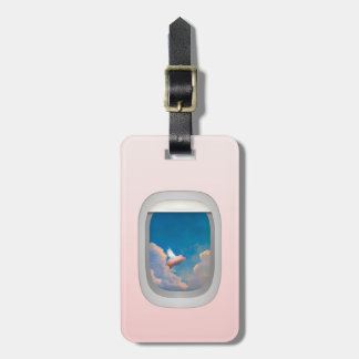 flying pig through airplane window luggage tag