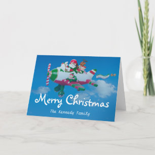 Flying Santa Claus with Elves in Airplane Holiday Card