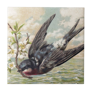 Flying swallow with flower twig tile