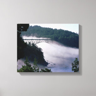 Fog drifts under the Deception Pass bridge at Canvas Print