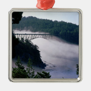 Fog drifts under the Deception Pass bridge at Metal Ornament