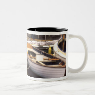 Fog surrounds four boats docked. Two-Tone coffee mug